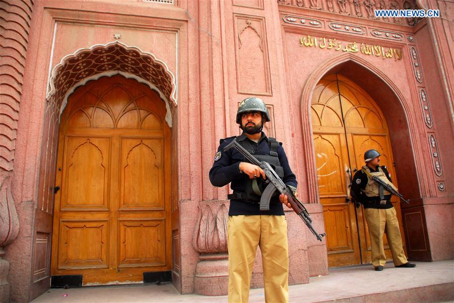 Policemen stand guard outside a mosque in northwest Pakistan's Peshawar on Feb. 17, 2017. 