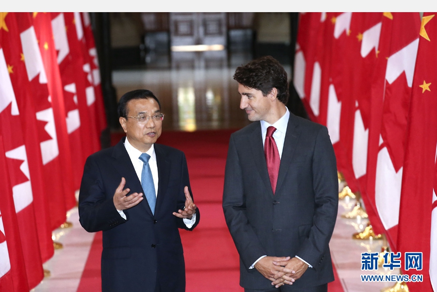 9月22日，国务院总理李克强在渥太华与加拿大总理特鲁多出席中加合作文件签署仪式。 新华社记者 庞兴雷 摄