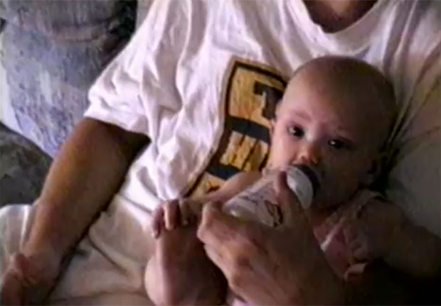 Hailie on her dad's lap in Mockingbird video