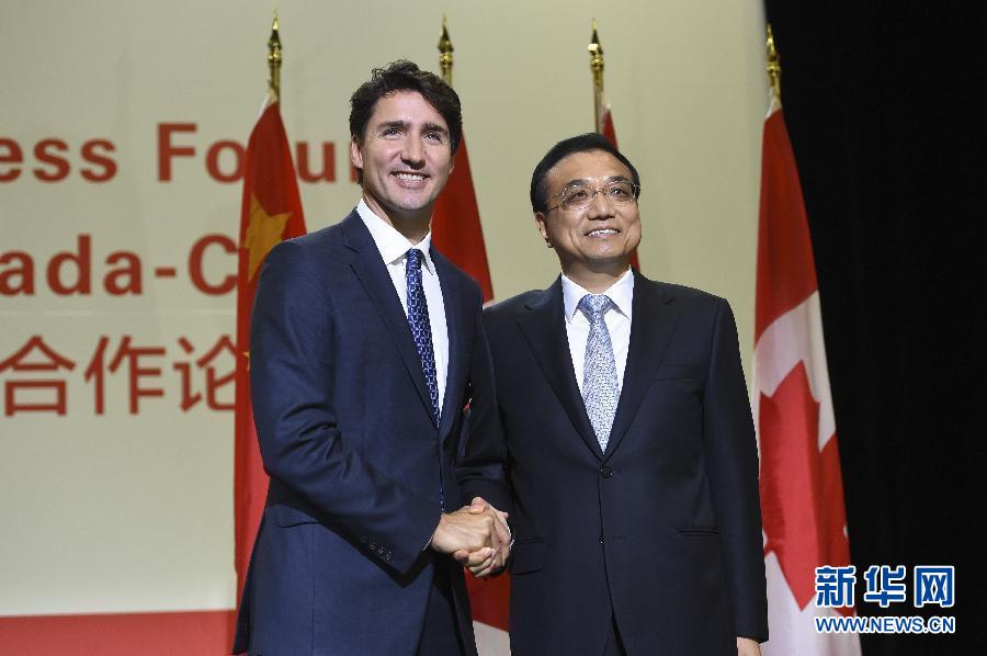 9月23日，国务院总理李克强在蒙特利尔会议中心与加拿大总理特鲁多共同出席第六届中加经贸合作论坛并发表致辞。 新华社记者李学仁摄